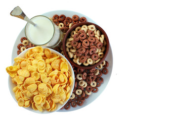 Corn flakes and glass of milk isolated on white background