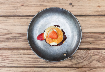 Scone with cream and strawberry jam
