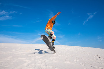 Sand boarding in desert. Low point shooting