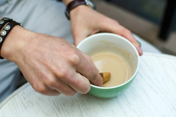 Young man drinking hot coffee