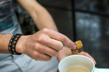 Young man drinking hot coffee