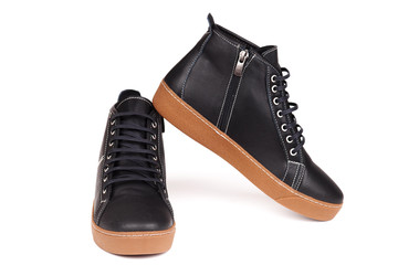 Stylish leather boots shot in studio, isolated on white