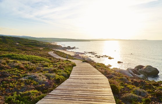Italy, Sardinia, Lu Litarroni, coastal path at sunset