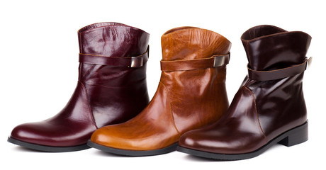 Stylish leather boots shot in studio, isolated on white