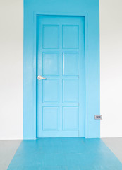 blue door on white wall