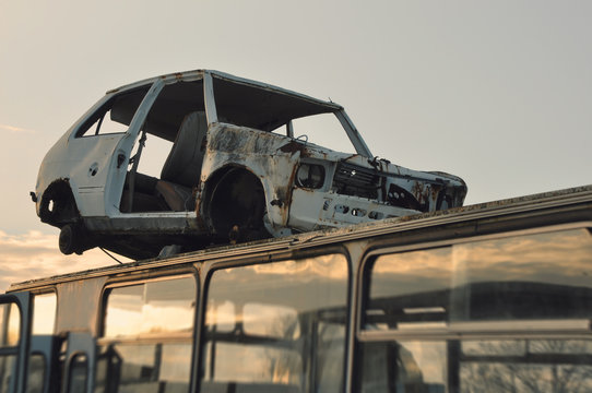 Old, rusted, crashed car at the junkyard