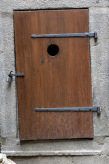 old wooden door with wrought iron on the castle