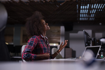 woman at her workplace in startup business office listening musi