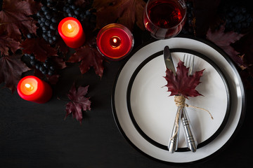 Autumn table setting on black wooden background © thayra83