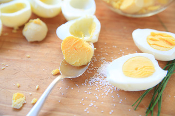 Removing yolks from hard-boiled eggs 