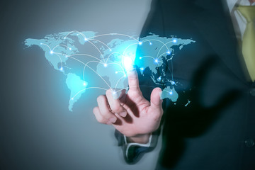 Businessman touching world technology. world communication conce