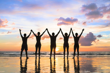 Silhouette group of people holding hands, beach, friendship, teamwork, success