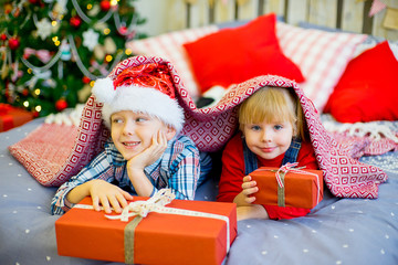 Fototapeta na wymiar boy and girl give Christmas gift