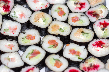 Fresh and delicious sushi and rolls of rice.