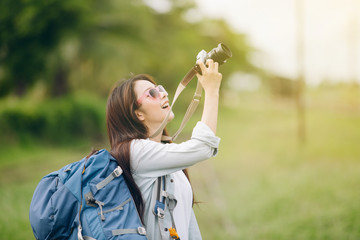 Asia woman with camera taking pictures,travel concept