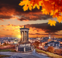 Fototapeta premium Edinburgh with Calton Hill against autumn leaves in Scotland