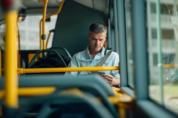 Foto op Canvas Businessman traveling by bus © stokkete