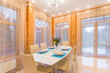 Served dining table in luxury wooden house