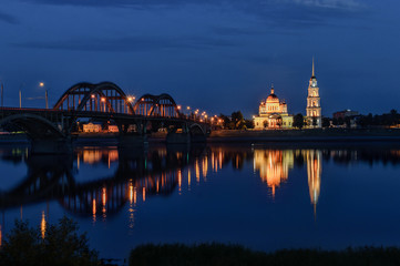 City landscape. City at night, the bridge across the river, the cathedral was consecrated.