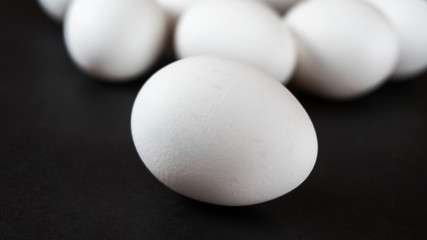 Eggs on black background