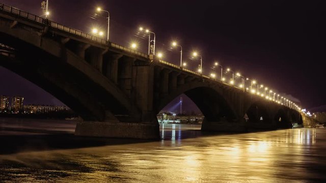 Road bridge over Yenisei River in the Russian Siberian city of Krasnoyarsk at the night, Time Lapse of Communal Night Bridge