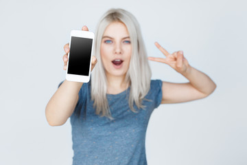woman hands holding white smartphone with blank screen