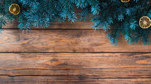 Christmas wooden background with fir tree. Copy space