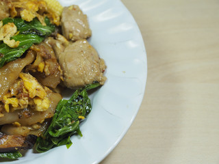closed up of fried noodle with pork in dish