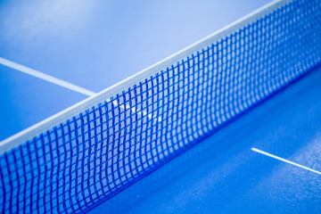 Net on blue ping pong table