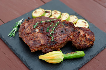 Rib eye steak on slate plate
