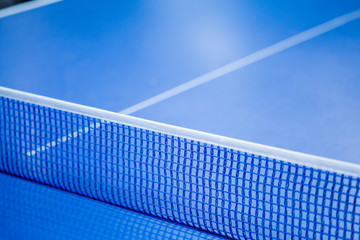 Fototapeta na wymiar Net on blue ping pong table