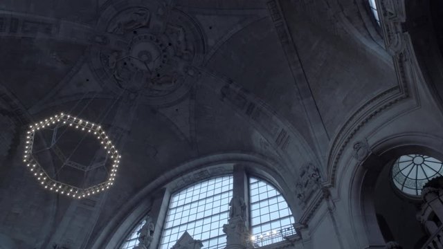 New Town Hall in Hanover, Germany. Pan from right to left on ceiling of the dome with it's dome lamp in 4K and S-Log3. Medium shot. Autumn. Neues Rathaus Hannover.