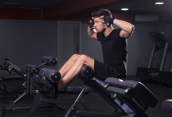 Fototapeta na wymiar man exercise, abs core, bench gym indoors.