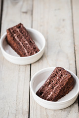 Two Pieces of Triple Chocolate Layer Cake