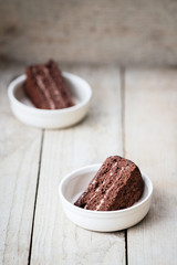 Two Pieces of Triple Chocolate Layer Cake