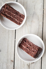 Two Pieces of Triple Chocolate Layer Cake