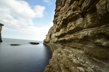 Fototapeta na wymiar beautiful rocks on the sea with long expsoure