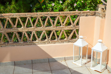 Fototapeta premium White candlesticks stand on balcony