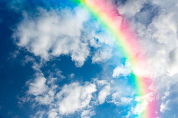 Blue sky and white cloud with sun light and rainbow