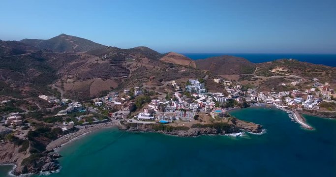 flying above town by seashore