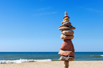 Concept of harmony and balance. Rock Zen on the beach