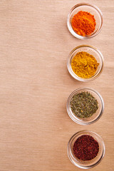 Many different spices in glass jars, and a special seasoning for pilaf. aromatic seasoning for cooking in the kitchen. 