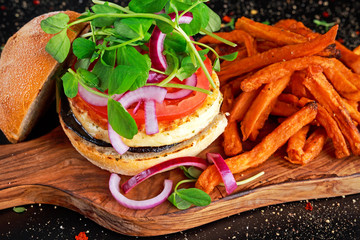 Halloumi cheese, mushroom Burger with sweet potatoes fries. concept of health food