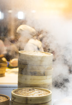 Asian street food - steamed dumplings in Beijing, kitchen interior in China