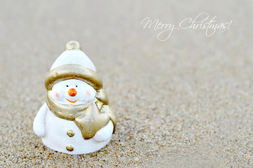 Christmas card with Snowman on the beach