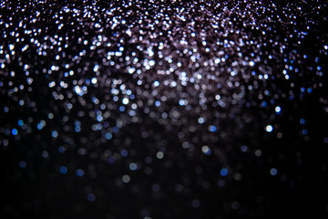 glitter vintage lights background.Abstract dark.