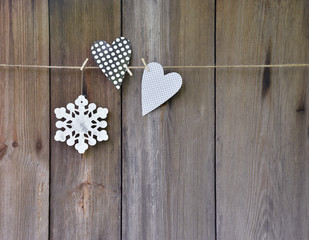Handmade Jewelry on a wooden background. Christmas. Heart and sn