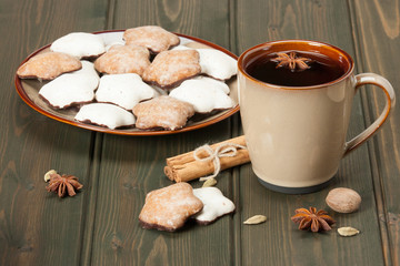 Mug Of Tea Or Coffee. Spices. Gingerbread Star Cookies With Icin