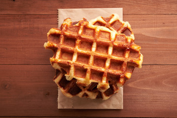 Belgian waffles on a wooden table