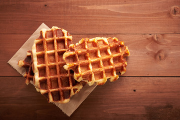 Belgian waffles on a wooden table
